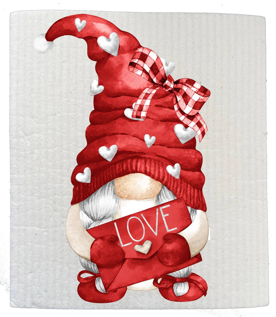 A red and white Swedish dishcloth with a Valentine theme, featuring a gnome with a bow, hearts, and a 'Love' banner.