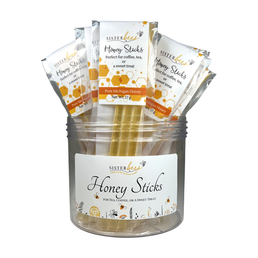 Jar of Sister Bee Honey Sticks with packaging on a white background