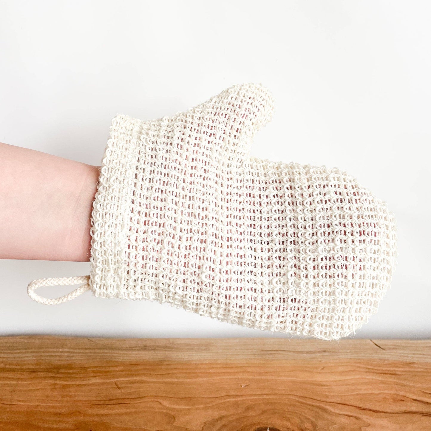 White mesh scrubber with a handle 