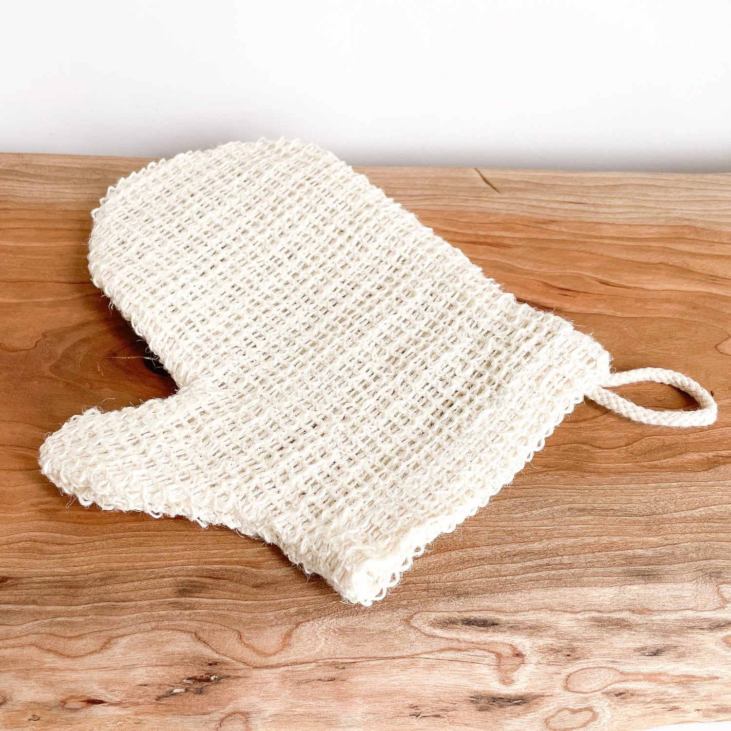 White mesh scrubber with a handle 