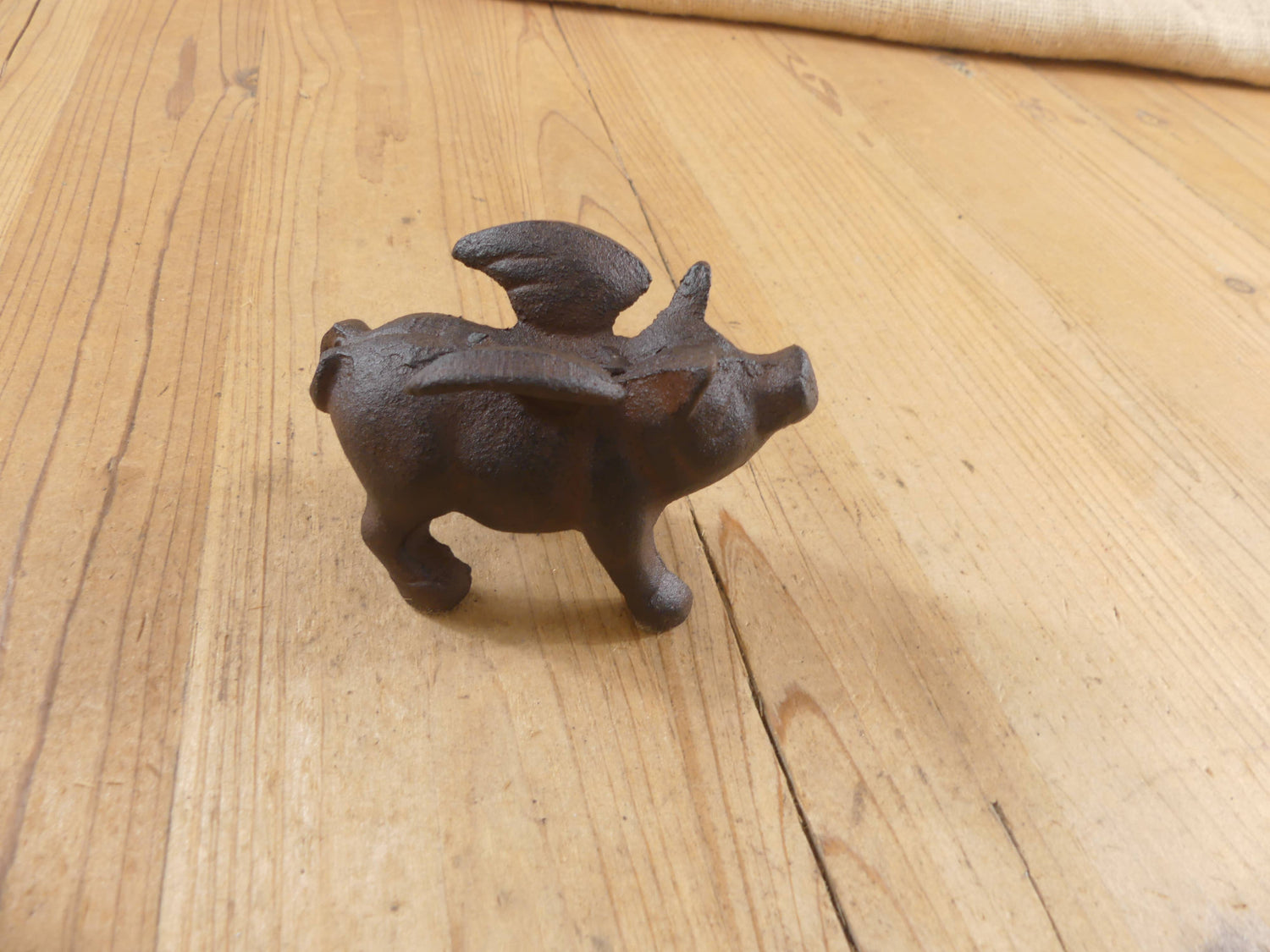Flying Pig Cast Iron Decor: More Than Just a Paper Weight - The Mirrored Past