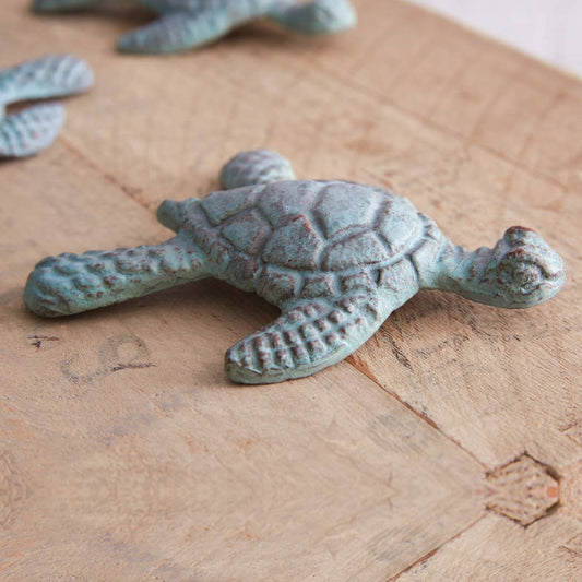Decorative turtle figurine on a wooden surface