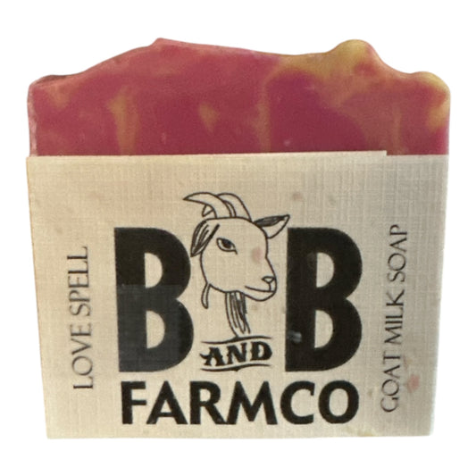 Bar of soap with a goat milk soap label on a white background
