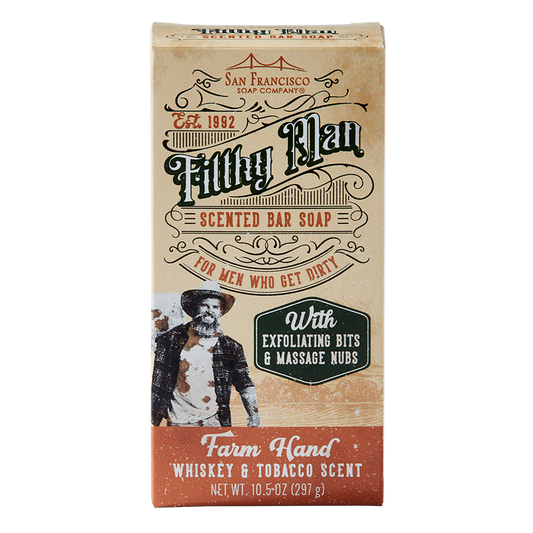 Packaging of 'Filthy Man' scented bar soap with 'Farm Hand Whiskey & Tobacco Scent' indicated, featuring exfoliating bits and massage nubs. The package is styled with vintage graphics and weighs 10 oz.